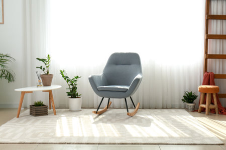 Interior of room with stylish armchair and houseplantsの写真素材
