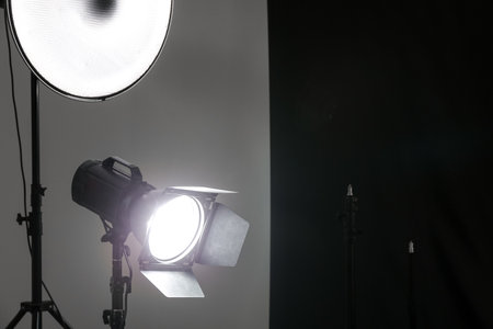 Glowing lighting equipment in modern photo studioの写真素材