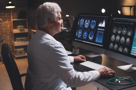 Senior neurologist with MRI scan of human head in clinicの写真素材