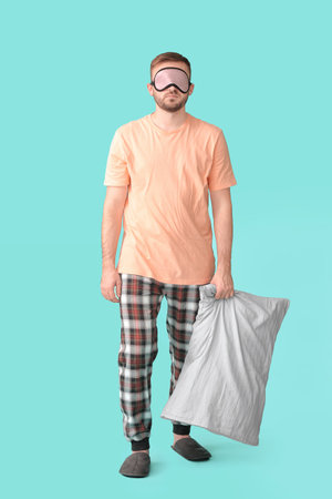 Male sleepwalker on color backgroundの写真素材