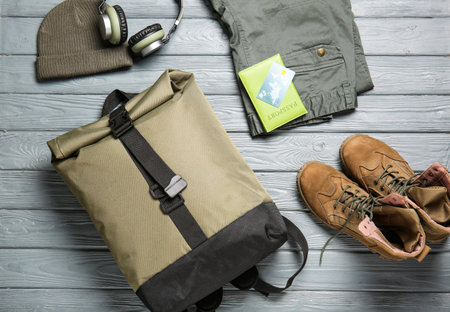 Set of traveler's accessories on wooden backgroundの写真素材