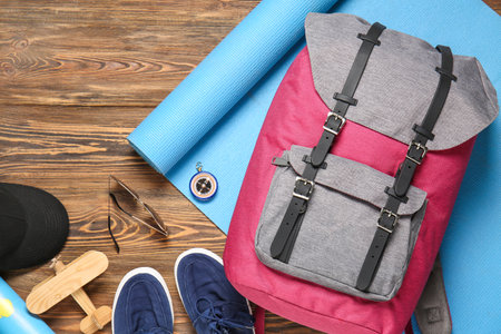 Set of traveler's accessories on wooden backgroundの写真素材