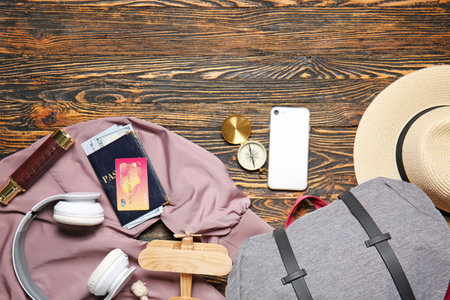 Set of traveler's accessories on wooden backgroundの写真素材