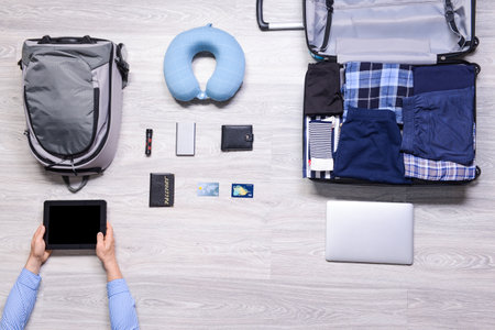 Set of travel accessories on wooden backgroundの写真素材