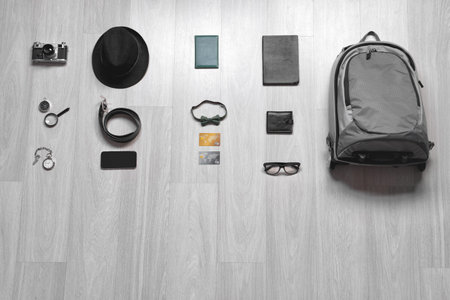 Set of travel accessories on wooden background