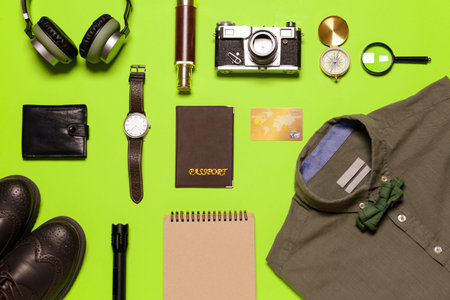Set of travel accessories for men on color background