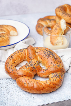 Tasty pretzels and condensed milk on light background, closeupの写真素材