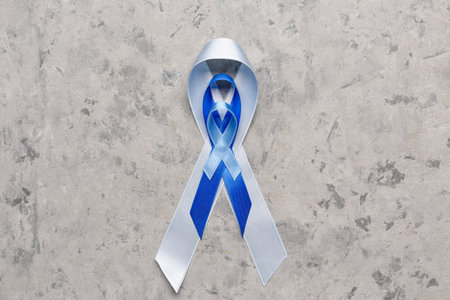 Blue awareness ribbons on grunge background. Prostate cancer conceptの写真素材