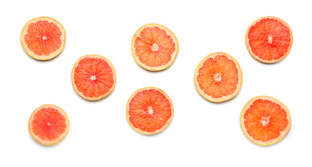 Composition with slices of ripe grapefruit on white backgroundの写真素材