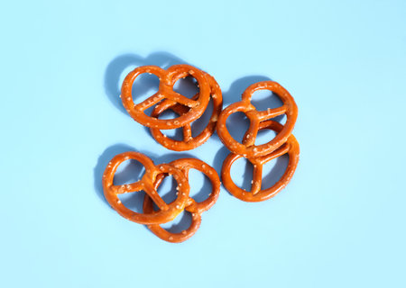 Tasty pretzels on color backgroundの写真素材