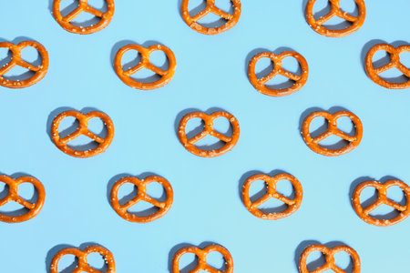 Composition with tasty pretzels on color backgroundの写真素材