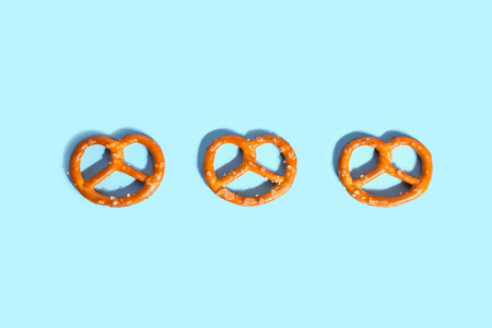 Tasty pretzels on color backgroundの写真素材