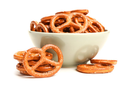 Bowl of tasty pretzels on white backgroundの写真素材