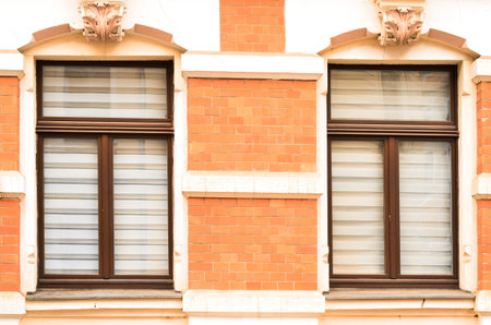 View of brick building with wooden windows