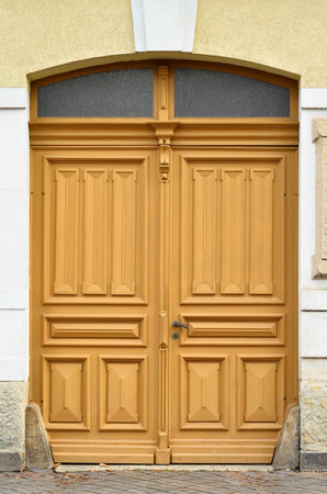 View of old building with wooden doorの写真素材