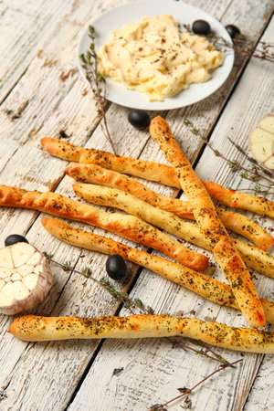 Tasty Italian Grissini on light wooden background, closeupの写真素材
