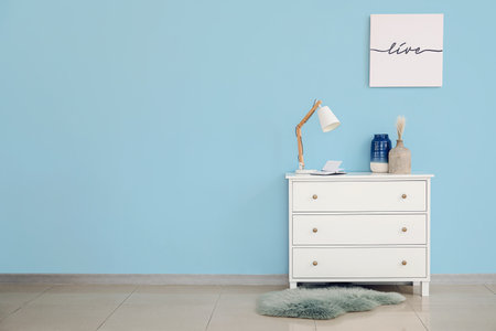 Modern chest of drawers in roomの写真素材