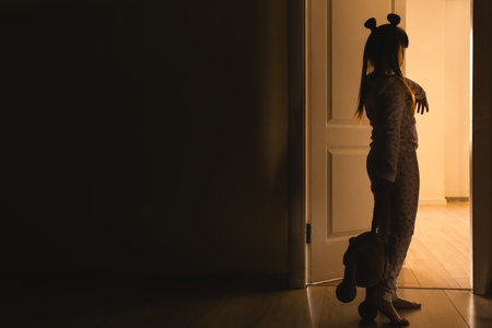Little sleepwalker at night in dark roomの写真素材