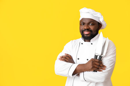 Male African-American chef on color backgroundの写真素材
