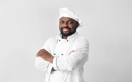 Male African-American chef on white backgroundの写真素材