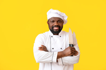 Male African-American chef on color backgroundの写真素材