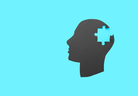 Human head with lost puzzle piece on color background. Concept of neurologyの写真素材