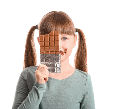 Cute funny girl with chocolate on white backgroundの写真素材