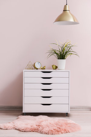 Modern chest of drawers in roomの写真素材