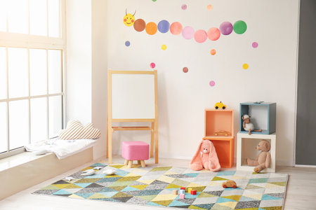 Stylish interior of modern playroom in kindergartenの写真素材