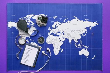 Check-list of things to pack for travel on world mapの写真素材