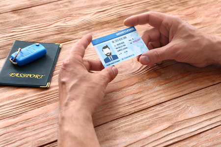 Man driving license at tableの写真素材