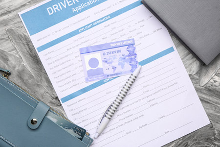 Driving license with application form and wallet on grunge backgroundの写真素材