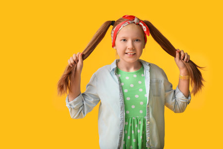 Cute redhead girl on color backgroundの写真素材
