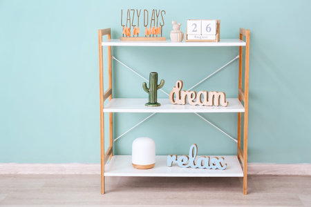 Shelving unit with decor near color wallの写真素材