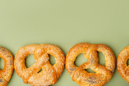 Tasty pretzels on green backgroundの写真素材