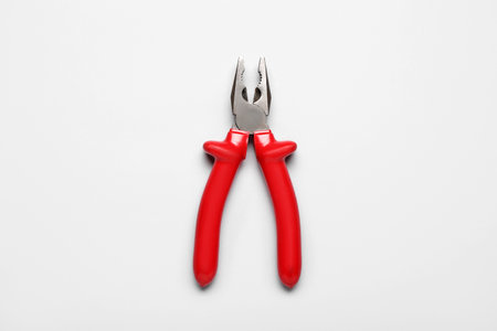 Red pliers on gray backgroundの写真素材