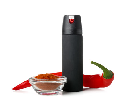 Spray with chili pepper and powder on white backgroundの写真素材