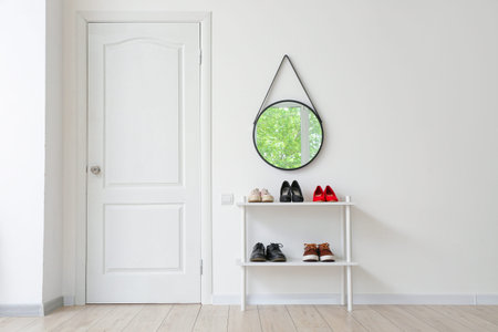 Stylish interior of modern hall with shoes on standの写真素材