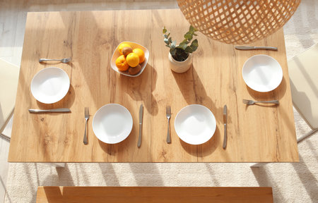Table set in modern stylish dining room, top viewの写真素材