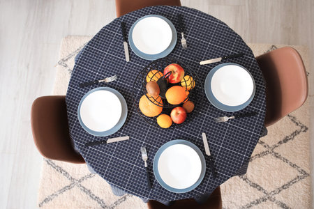 Table set in modern stylish dining room, top view