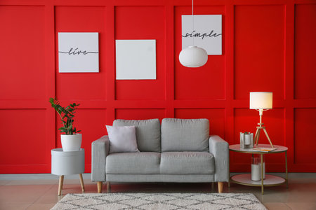 Stylish interior of living room with sofa and lampsの写真素材