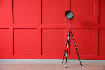 Stylish lamp near color wall in roomの写真素材