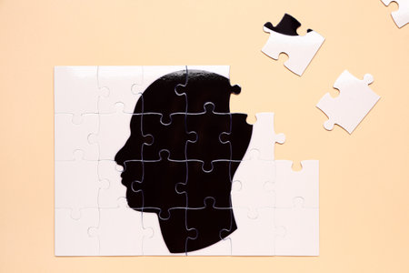 Puzzle with drawn human head on color background. concept of dementiaの写真素材