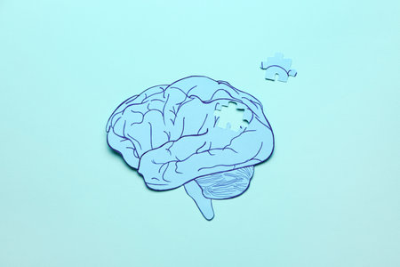 Human brain and lost piece on color background. concept of dementiaの写真素材