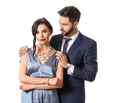 Young couple wearing stylish accessories on white backgroundの写真素材