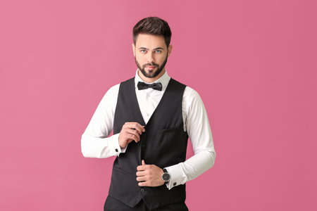 Young man in formal clothes on color backgroundの写真素材