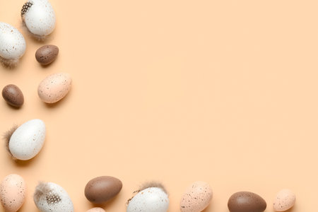 Frame made of Easter eggs with feathers on beige backgroundの写真素材