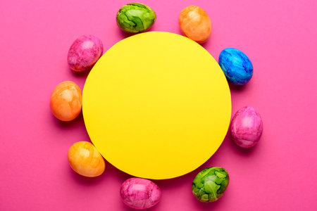 Blank card with Easter eggs on pink backgroundの写真素材