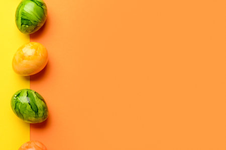 Easter eggs on yellow and orange background