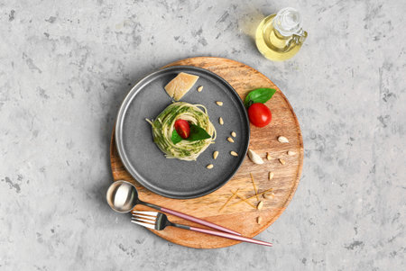 Plate with tasty pesto pasta on grunge backgroundの写真素材